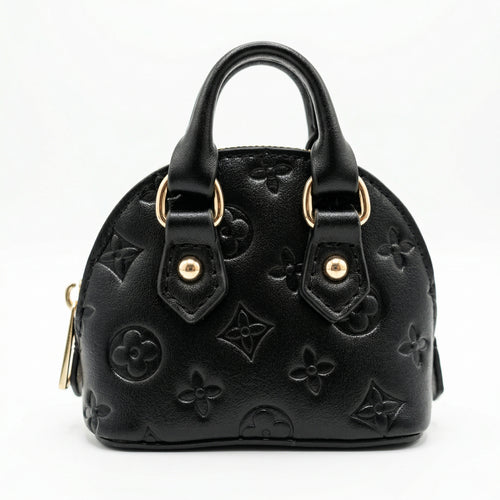 Black handbag with gold hardware on a white background